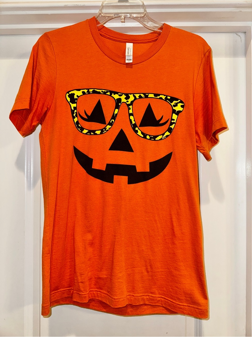 Bella Cavas Women’s Orange Pumpkin Face with Glasses Graphic Tee - Small
